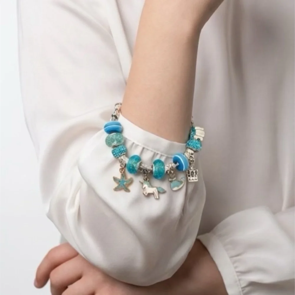 Child’s Silver Tone Blue Unicorn Charm and Glass Bead Bracelet